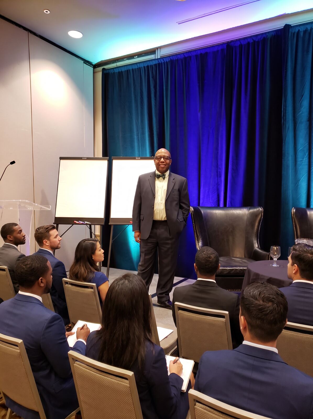 Elder Will Huff speaking to marketplace leaders at a business conference